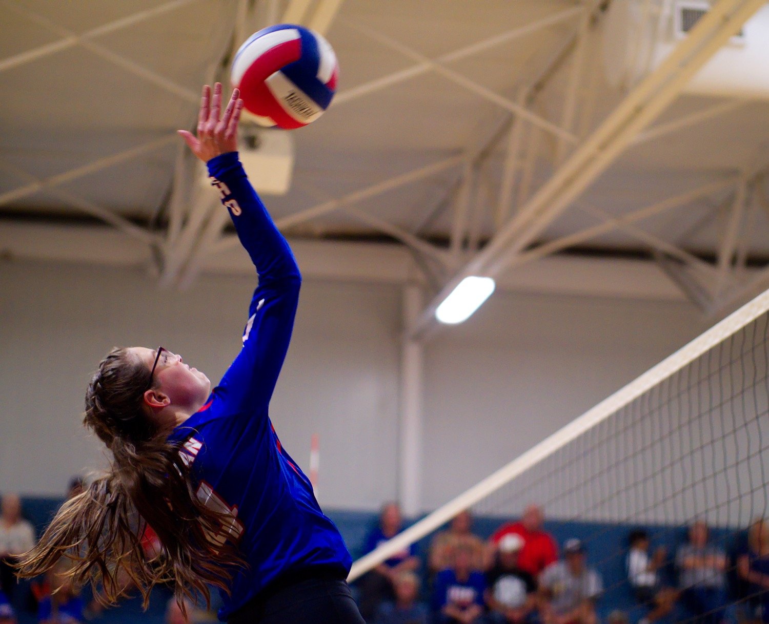 Emilee Baker goes in for the kill. [view more volleyball shots]